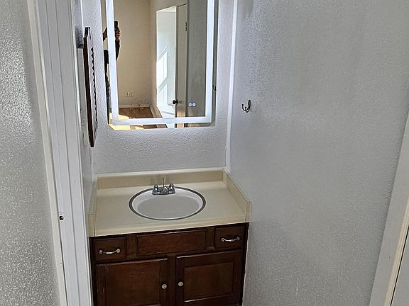 Updated floors and new mirror with lighting. Fresh new paint