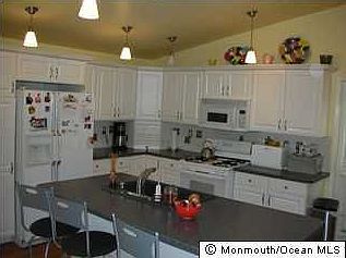 Newer kitchen with center island opens to family room
