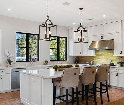 Island marble countertops and view of backyard