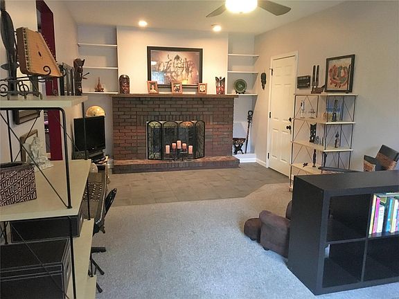 Very large family room with built in bookcases and functioning wood burning fireplace.