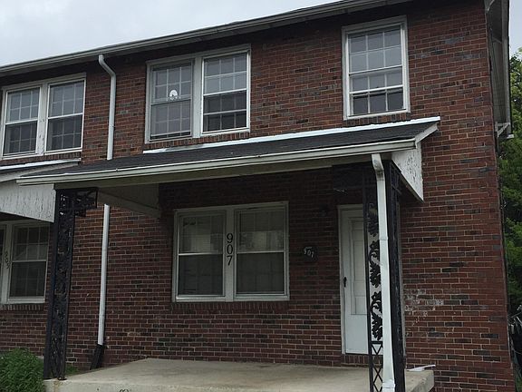 Brick exterior with off street parking and front and rear po