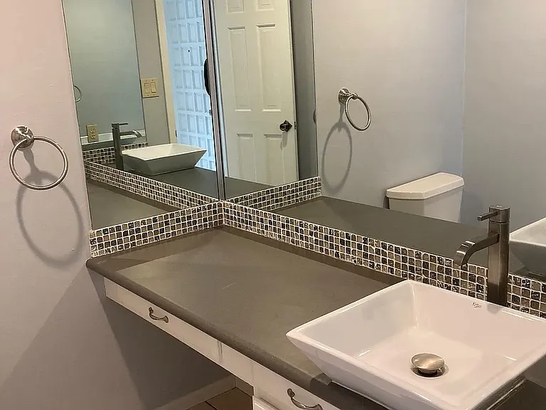 Updated kitchen with granite countertops, stainless steel appliances, and ample cabinet storage.