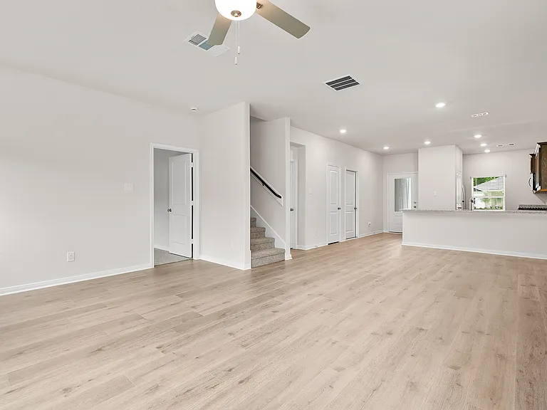 The open layout connects the kitchen, dining room and living room.