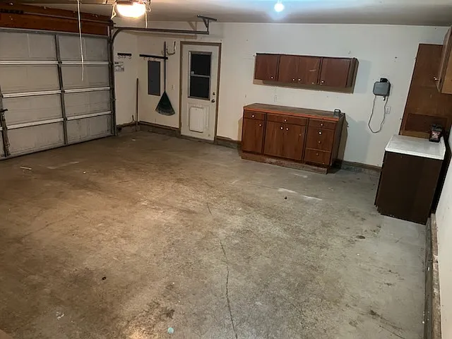 2 car garage with work bench and storage