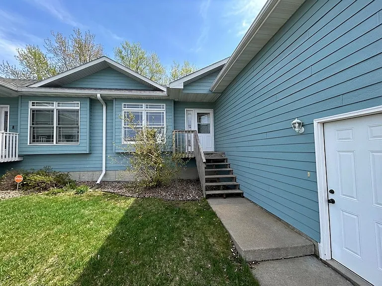 front of twin home and garage entry door