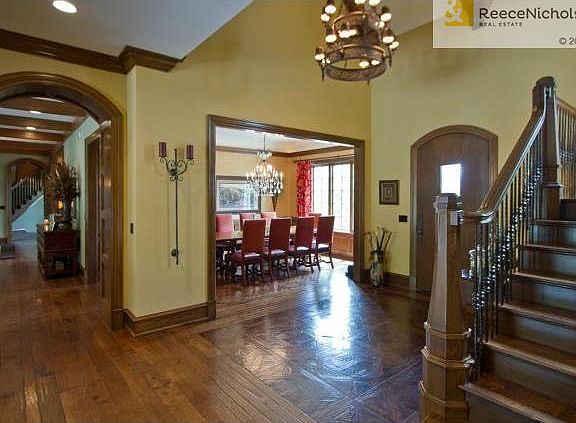 Beautiful archways lead you to the kitchen and utility area...