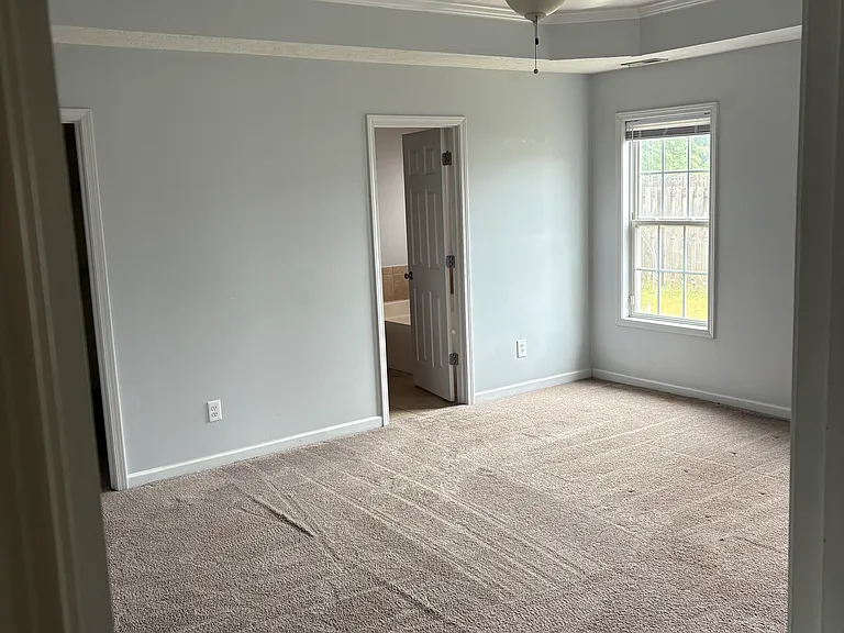 Spacious cozy master bedroom with walking closet