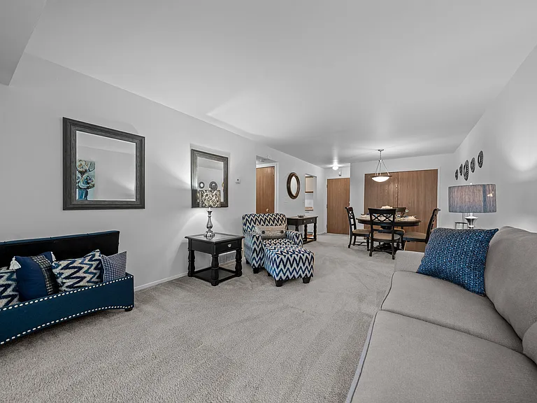 Spacious living room with natural light at Westwood Village Apartments in Westland, MI