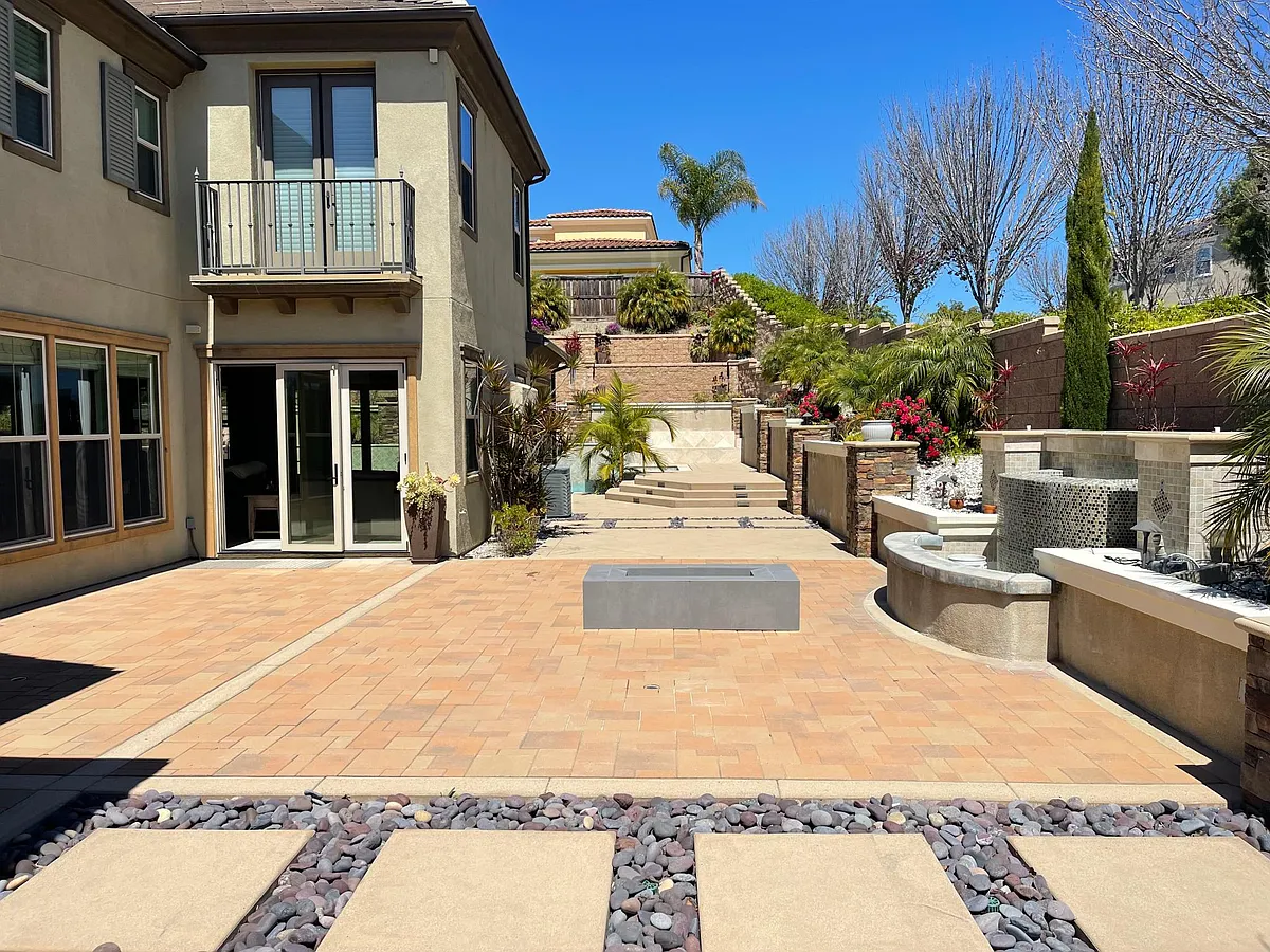 Indulge in the beauty of the connected patio, adorned with lush landscaping. - 3646 Buck Ridge Ave