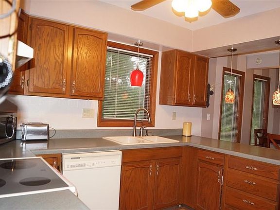 View of the kitchen from garage entry.