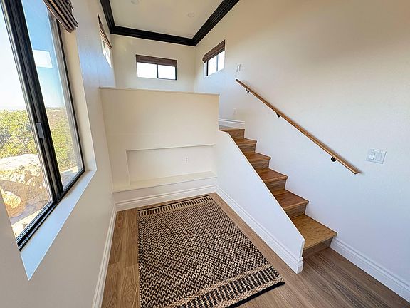 New construction with beautiful windows, spacious 12' high ceilings, crown molding and vinyl plank floors