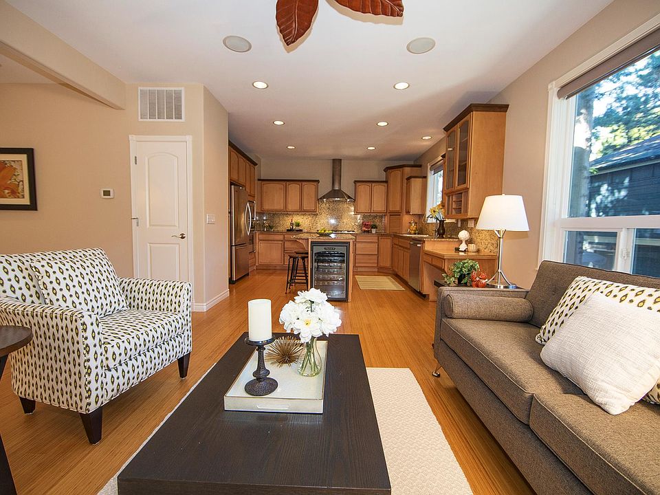 Large living area and open kitchen concept with high 10-ft ceilings with built-in speakers throughout the main floor.