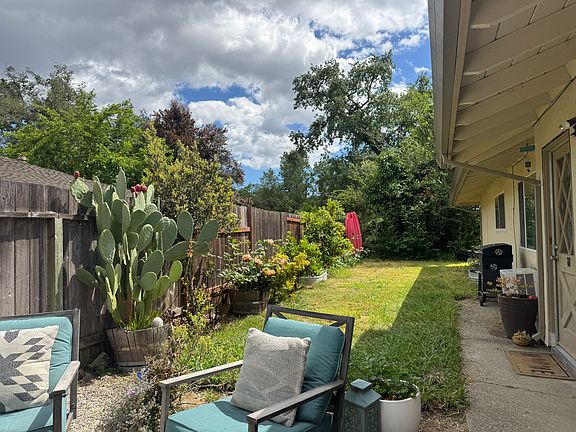 View from the entrance gate. Sitting area on the left. Entrance door on the right.
