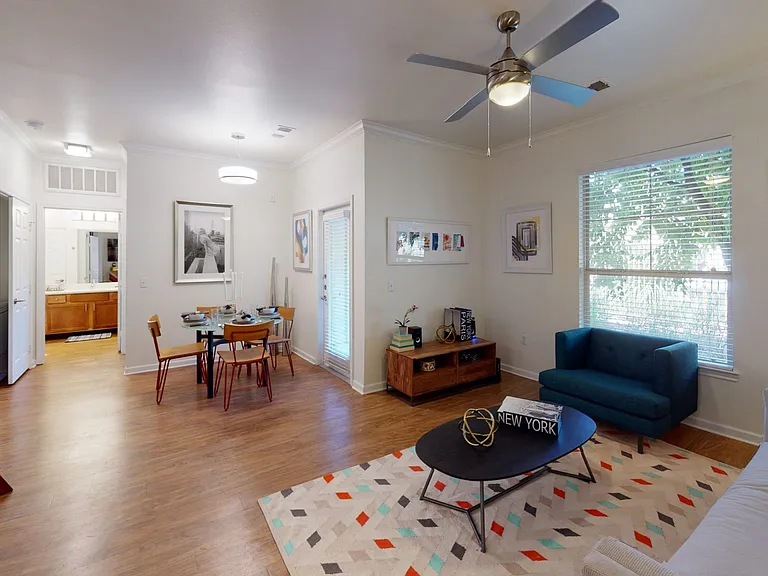 Apartment living room with wood-style flooring.