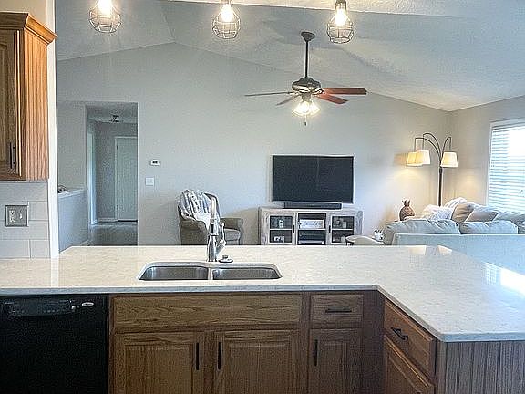 Kitchen viewing living room