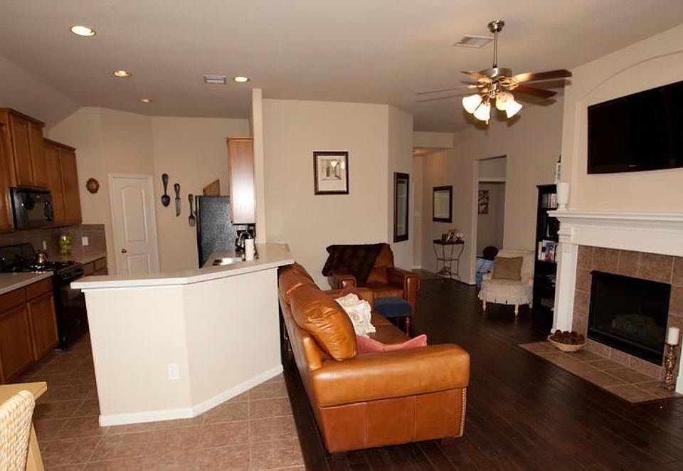Large Living Room with Gas Fireplace, Ceramic tile and World oak wood flooring throughout most of the house.