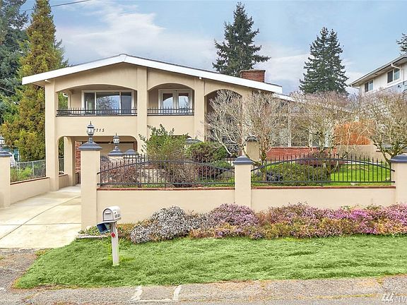 Welcome home to this charming Spanish style home in SeaTac! This 3 bedroom 1 bathroom home will make you feel like you have escaped to a European Villa, with incredible architectural details beginning at the grand entrance. Enjoy an abundance of sunshine that flows through this home. The open living room features a double-sided gas fireplace, skylights, raised brick hearth and vaulted ceiling. Recent updates include hardwood floors, freshly painted interior and exterior, all new interior doors, craftsman-style millwork, updated bath and much more. You will be thrilled to cook in this stylish kitchen with brand new quartz counters, stainless steel appliances & pull-out cabinet drawers. French doors off the dining room open to a sizeable patio - ideal for any occasion. The master bedroom is truly an intimate retreat! Cozy up with your favorite book in the seating area, or relax on the gorgeous Spanish style covered balcony with stunning views of Mt. Rainier.