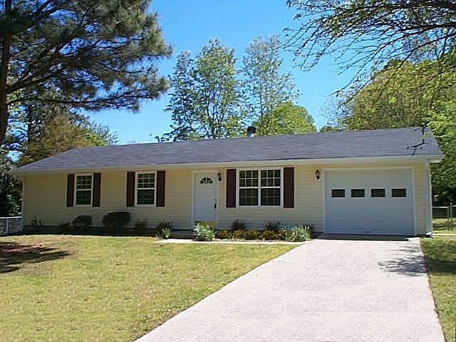 Lovely Ranch on a level fenced lot! Exterior features new vinyl siding, new wi