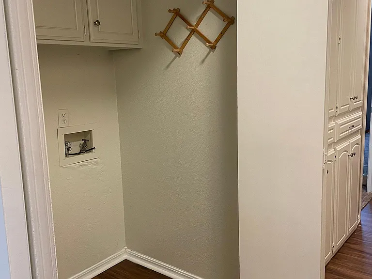 laundry room as you enter the hallway leading to bedrooms.