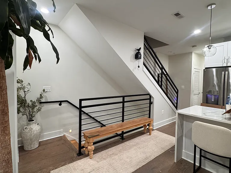 These stairs lead up from the building's hallway into the unit