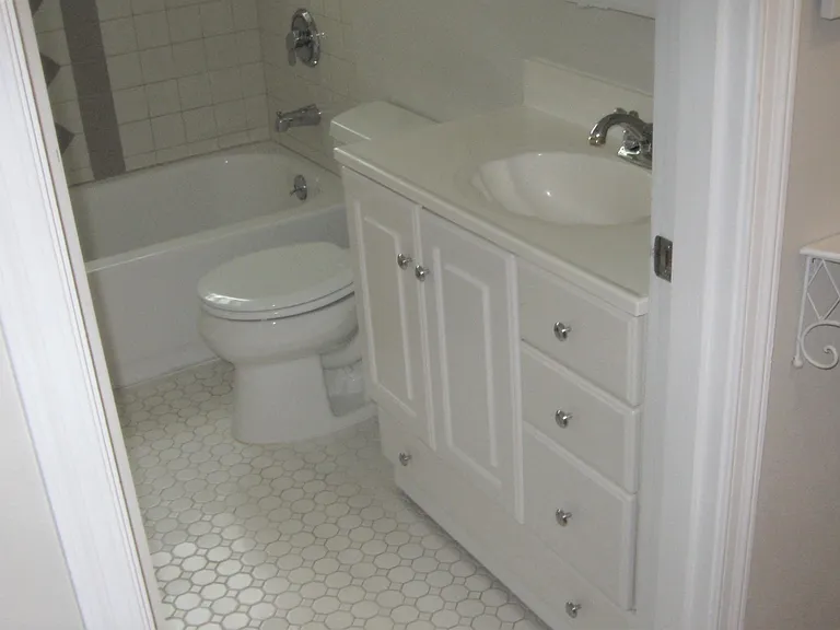 ML Bath also has a closet with wood shelves.