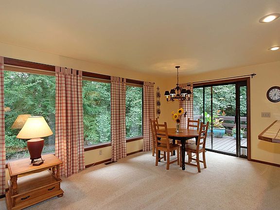Light-filled dining area with deck access