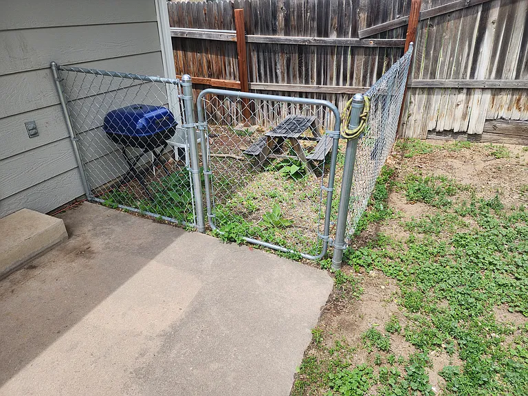 Fenced off area, backyard.