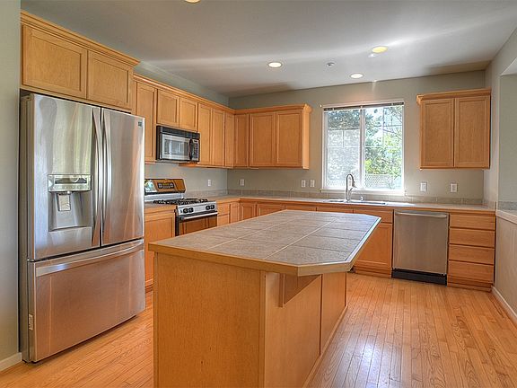 Kitchen with large center island, s/s appliances, walk-in pa