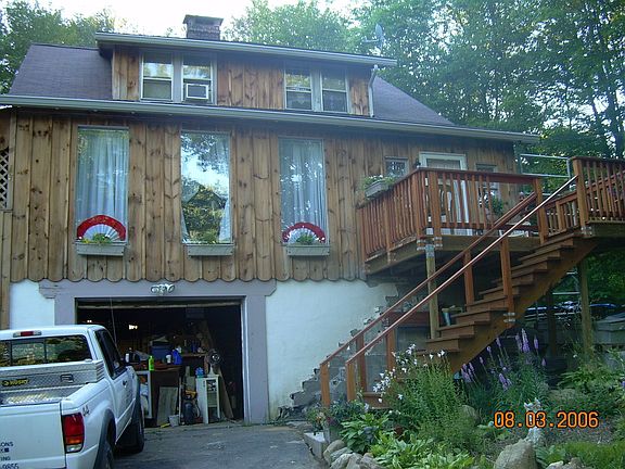 front, new cedar porch and garage door