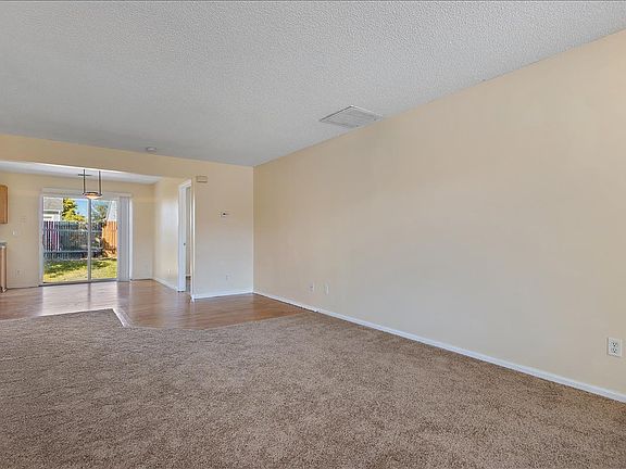 Open floorplan; front living room and dining area.