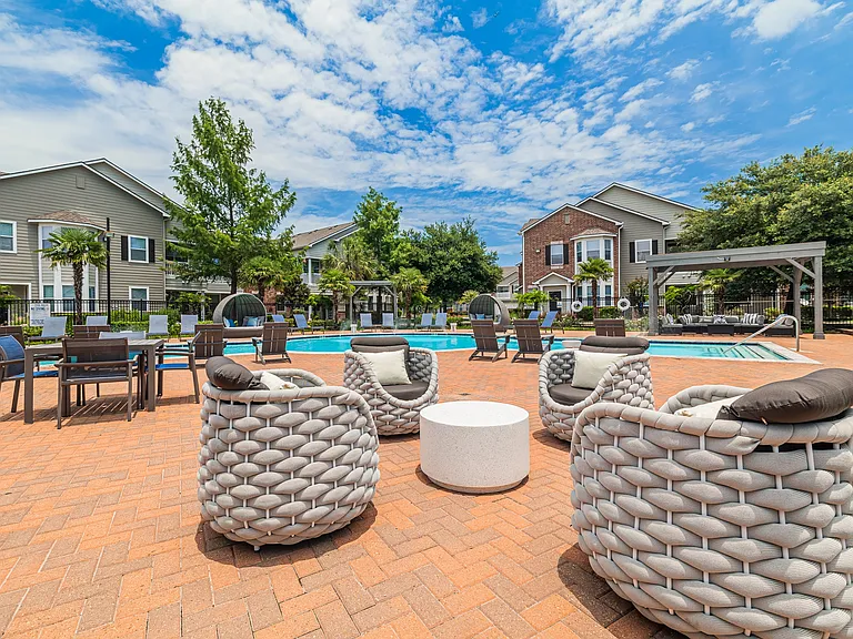 Outdoor lounge and patio seating in our pool area