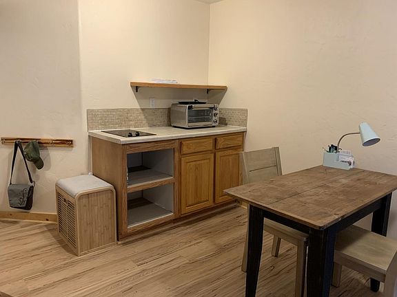 Kitchen with table from prior renter.