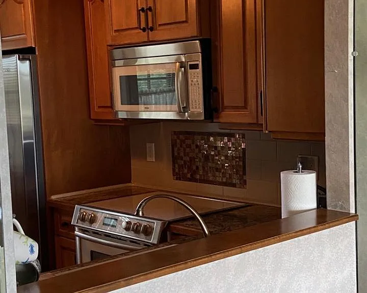 large pass through between kitchen and dining room.