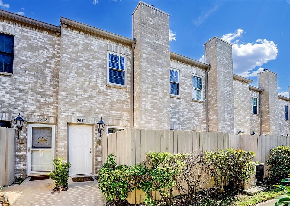 The front of the home is on a walkway from the driveway, secluded from the road and has nice greenery leading up to the door. Garage entrance is on the other side of the house.