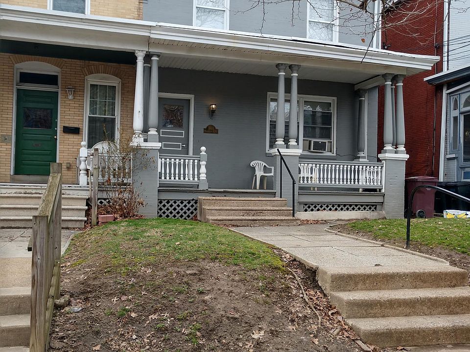 Gray home on the left 