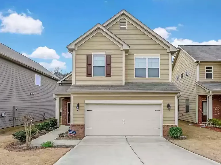 Welcome home to this beautifully maintained residence with undeniable curb appeal and a charming front entry.
