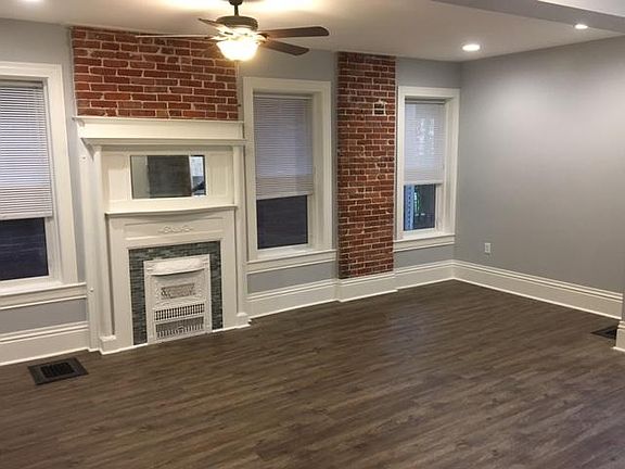 Large Living/Dining Room opening to kitchen with fireplace
