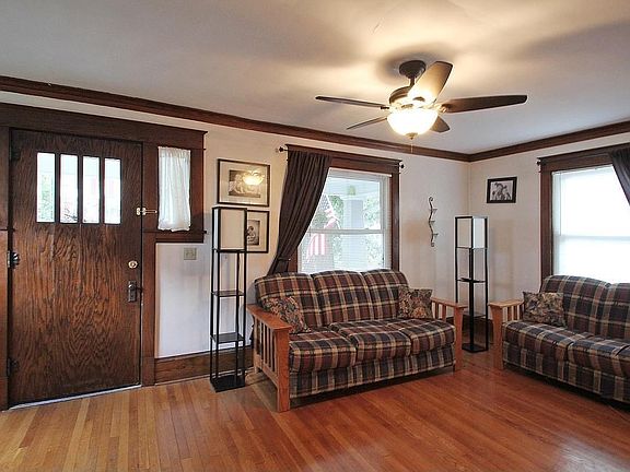 Roomy sundrenched living area with gorgeous hardwood floor.