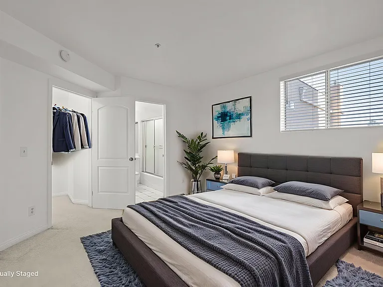 Second bedroom on third floor with bathroom and south and west facing windows