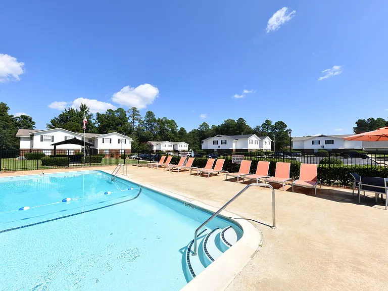 Pool area with lounge chairs