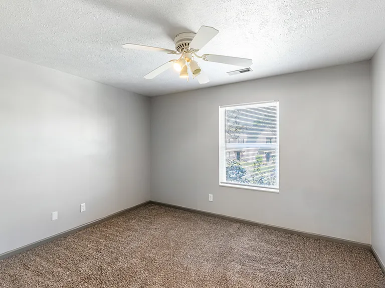 Large bedroom with ceiling fan