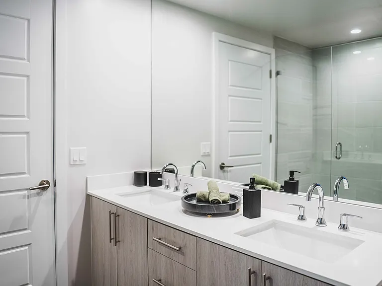 Serene bathrooms with spa-like soaking tubs or tiled shower.