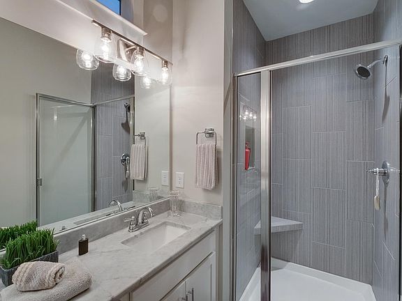 Beautiful primary bath with a nice shower and double sinks.