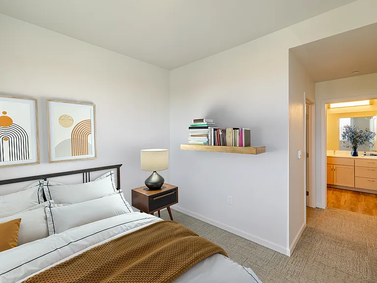 Bedroom B has warm lighting and a homey atmosphere.