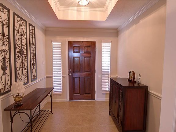 Welcome guests into the home from your entry foyer with trayed ceiling and crown molding.