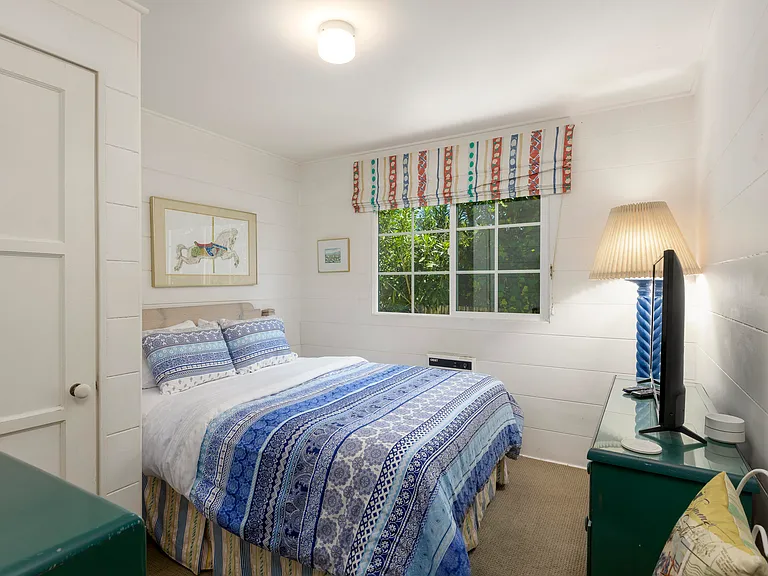Queen bedroom with flat screen tv.