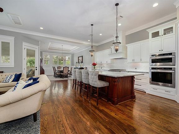 Enter the FIRST floor living and be wowed by the open concept floor plan! Custom built cabinetry, window coverings, light and bright space with lots of windows.