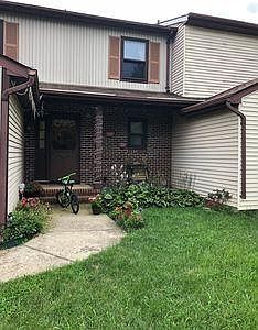 front entry with well maintained small yard