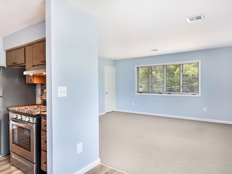 Sundrenched living room is next to the dining area.