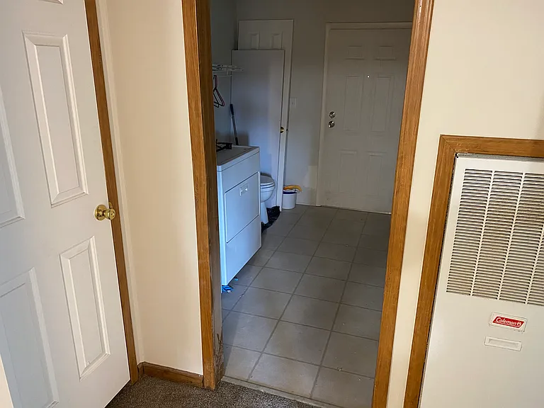 Laundry room and Back Door to covered porch walkway and Backyard.